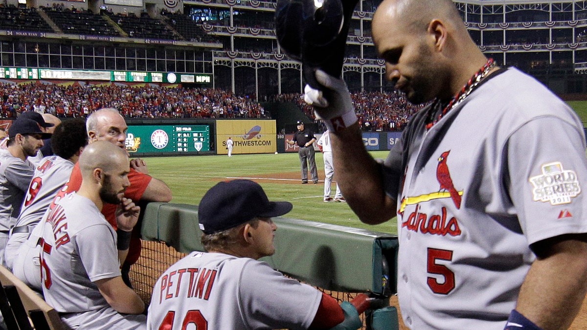 Pujols gives jersey off back to young fan