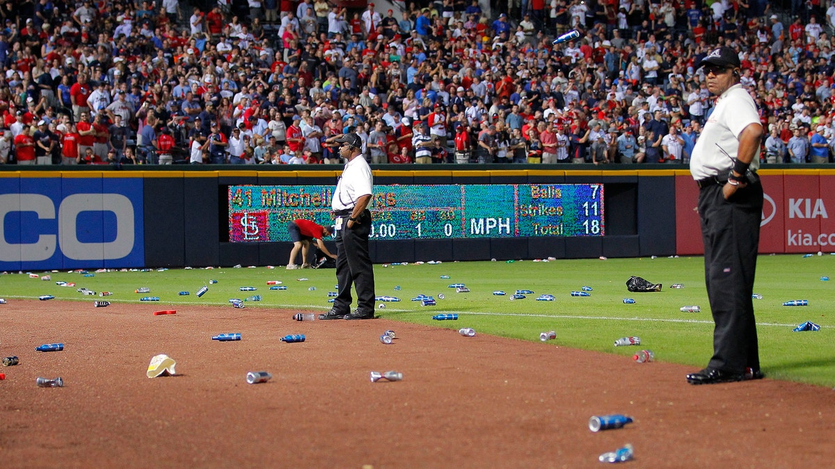 Fans trash the field after disputed call as Cardinals beat Braves 6-3 in  wild card