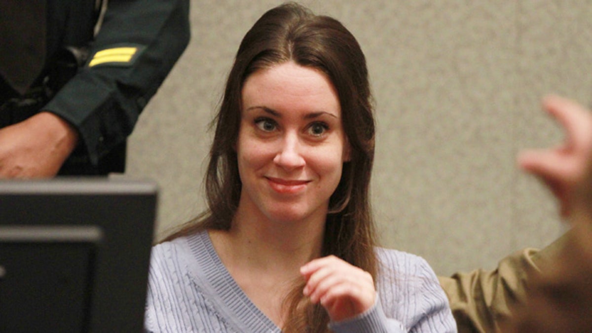 ORLANDO, FL - JULY 07: Casey Anthony smiles before the start of her sentencing hearing on charges of lying to a law enforcement officer at the Orange County Courthouse July 7, 2011 in Orlando, Florida.  Anthony was acquitted of murder charges on July 5, 2011 but will serve four, one-year sentences on her conviction of lying to a law enforcement officer. She will be credited for the nearly three-years of time served and good behavior and will be released July 13.  (Photo by Joe Burbank-Pool/Getty Images)