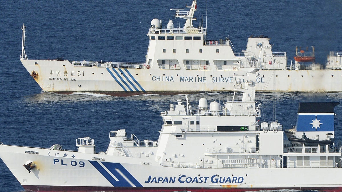 Oct. 25, 2012: Ships of China Marine Surveillance and Japan Coast Guard steam side by side near disputed islands, called Senkaku in Japan and Diaoyu in China, in the East China Sea. 