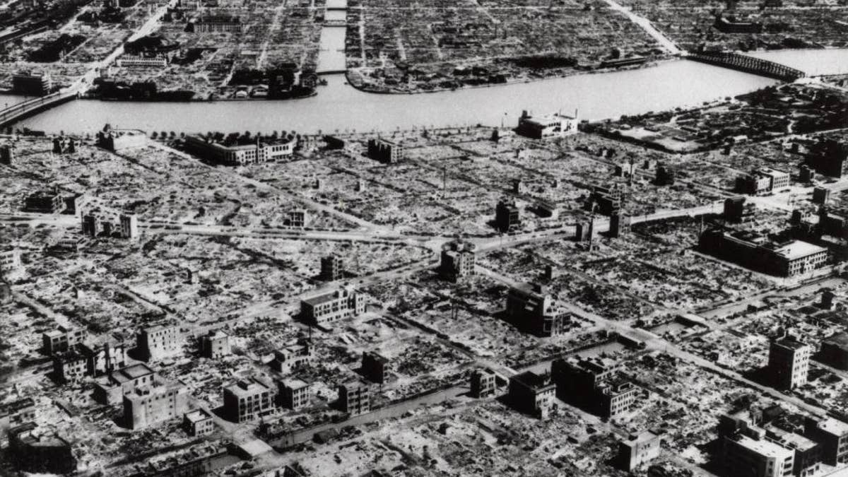 FILE - This aerial photo taken in March 9, 1945 shows the industrial section of Tokyo along the Sumida River. The nuclear bombs dropped by the United States on Hiroshima and Nagasaki in August 1945 killed about 130,000 people, secured Japan's surrender and ended World War II. Less well-known, perhaps, is Operation Meetinghouse - the firebombing of Tokyo five months earlier. (AP Photo, File)