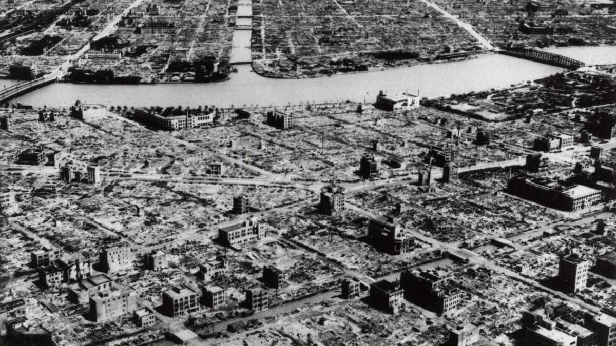 FILE - This aerial photo taken in March 9, 1945 shows the industrial section of Tokyo along the Sumida River. The nuclear bombs dropped by the United States on Hiroshima and Nagasaki in August 1945 killed about 130,000 people, secured Japan's surrender and ended World War II. Less well-known, perhaps, is Operation Meetinghouse - the firebombing of Tokyo five months earlier. (AP Photo, File)