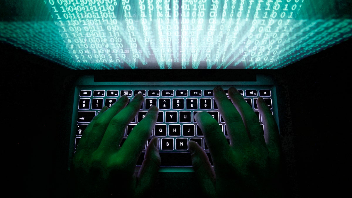 A man types on a computer keyboard in Warsaw in this February 28, 2013 illustration file picture. One of the largest ever cyber attacks is slowing global internet services after an organisation blocking "spam" content became a target, with some experts saying the disruption could get worse. To match INTERNET-ATTACK/ REUTERS/Kacper Pempel/Files (POLAND - Tags: BUSINESS SCIENCE TECHNOLOGY) - RTXXZVX