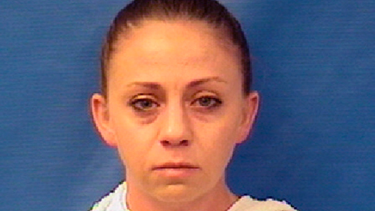 FILE - This file photo provided by the Kaufman County Sheriff's Office shows Amber Renee Guyger. Guyger, a Dallas police officer accused of fatally shooting her neighbor inside his own apartment has been dismissed, the police department announced Monday, Sept. 24, 2018. The Dallas Police Department fired Guyger weeks after she fatally shot 26-year-old Botham Jean inside his own apartment on Sept. 6. Court records show Guyger said she thought she had encountered a burglar inside her own home.(Kaufman County Sheriff's Office via AP, File)