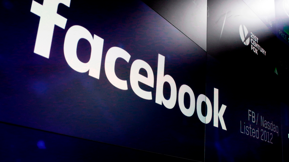 FILE - In this March 29, 2018, file photo, the logo for Facebook appears on screens at the Nasdaq MarketSite in New York's Times Square. (AP Photo/Richard Drew, File)