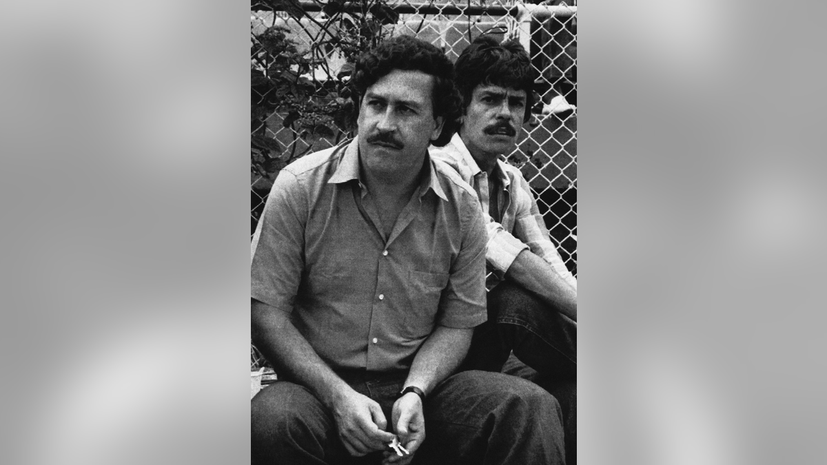 In this 1983 file photo, Medellin drug cartel boss Pablo Escobar watches a soccer game in Medellin, Colombia. (AP Photo, File)