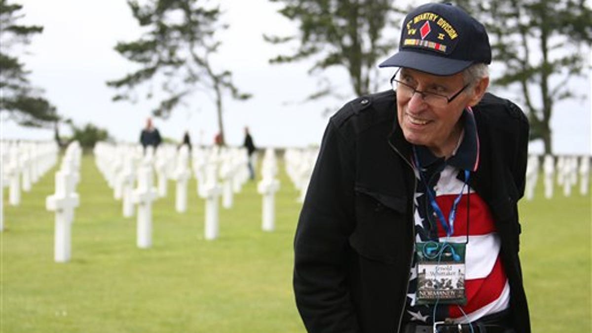 WWII veteran Arnold Whittaker of the 3rd Army, 5th Infantry Division, 10 Infantry Regiment company K, of Atlanta, Georgia, visits the U.S military cemetery in Colleville sur Mer, western France, Monday, June 6, 2011 during the 67th D Day Anniversary. World War II veterans and Sen. John Kerry commemorated the D-Day landings in Normandy at an iconic and eroding cliff. The visit is one of several events along the coast Monday marking 67 years since Allied forces landed on a swath of beaches in Nazi-occupied France. The June, 6, 1944, invasion and ensuing battle for Normandy helped change the course of the war. (AP Photo/Vincent Michel)