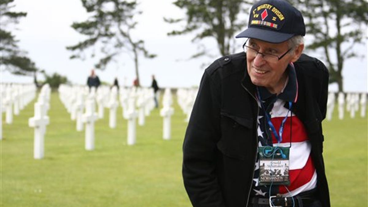 WWII veteran Arnold Whittaker of the 3rd Army, 5th Infantry Division, 10 Infantry Regiment company K, of Atlanta, Georgia, visits the U.S military cemetery in Colleville sur Mer, western France, Monday, June 6, 2011 during the 67th D Day Anniversary. World War II veterans and Sen. John Kerry commemorated the D-Day landings in Normandy at an iconic and eroding cliff. The visit is one of several events along the coast Monday marking 67 years since Allied forces landed on a swath of beaches in Nazi-occupied France. The June, 6, 1944, invasion and ensuing battle for Normandy helped change the course of the war. (AP Photo/Vincent Michel)