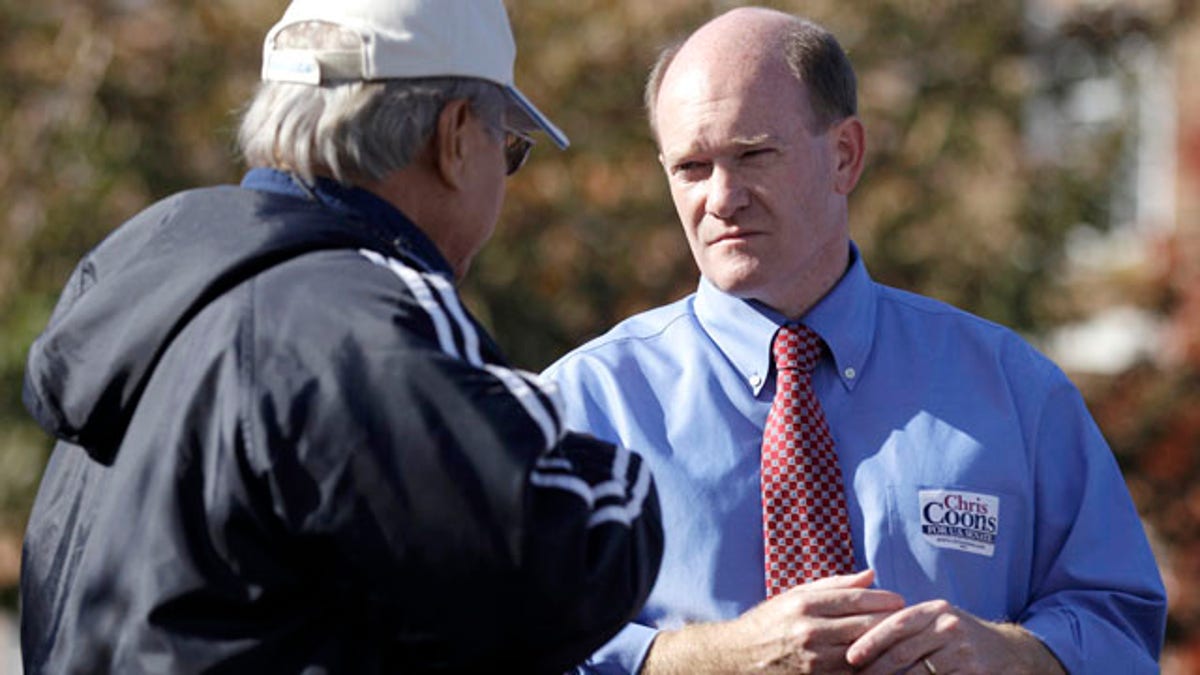 Nov. 2: Delaware Democratic Senate candidate Chris Coons, right, talks with Venerando Maximo, outside a polling station in Dover, Del.