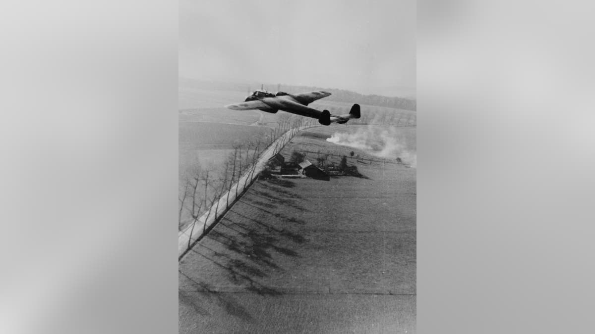 A Dornier 17Z of the Luftwaffe flying low over the English countryside.
