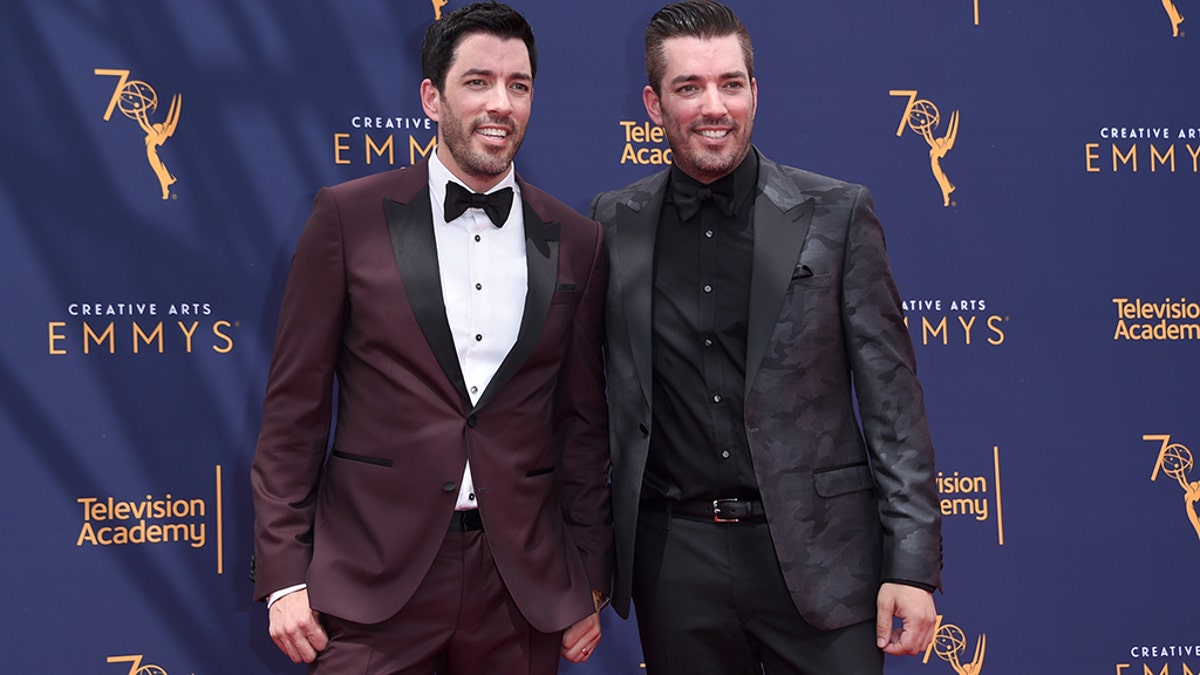 Drew Scott, left, and Jonathan Scott arrive at night two of the Creative Arts Emmy Awards at The Microsoft Theater on Sunday, Sept. 9, 2018, in Los Angeles.