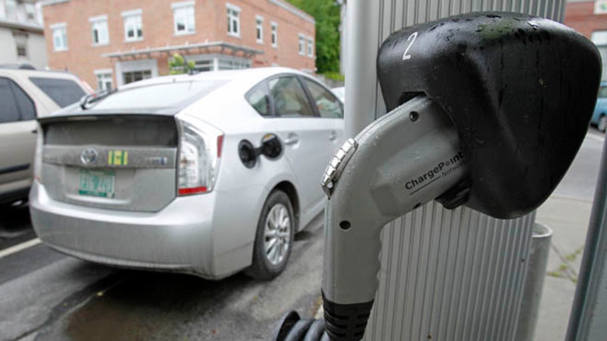 An electric charging station is seen on Tuesday, June 18, 2013 in Montpelier, Vt. Vermont Gov. Peter Shumlin and Quebec Premier Pauline Marois say they're implementing an electric vehicle charging corridor across the international boundary between the state and province. The corridor will initially link Burlington and Montreal with more than 20 charging stations along the 138-mile route.(AP Photo/Toby Talbot)