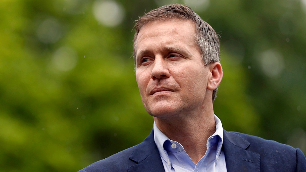 FILE - In this May 17, 2018 file photo, Missouri Gov. Eric Greitens looks on before speaking at an event near the capitol in Jefferson City, Mo. Allegations of sexual misconduct and campaign finance violations against Greitens have been shared with federal authorities by both a private attorney and a key lawmaker, according to testimony Thursday, May 24, 2018, during a legislative hearing by a special committee considering whether to recommend impeachment. (AP Photo/Jeff Roberson, File)