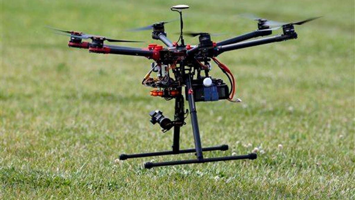 In this photo taken June 11, 2015, a hexacopter drone is flown during a demonstration in Cordova, Md.