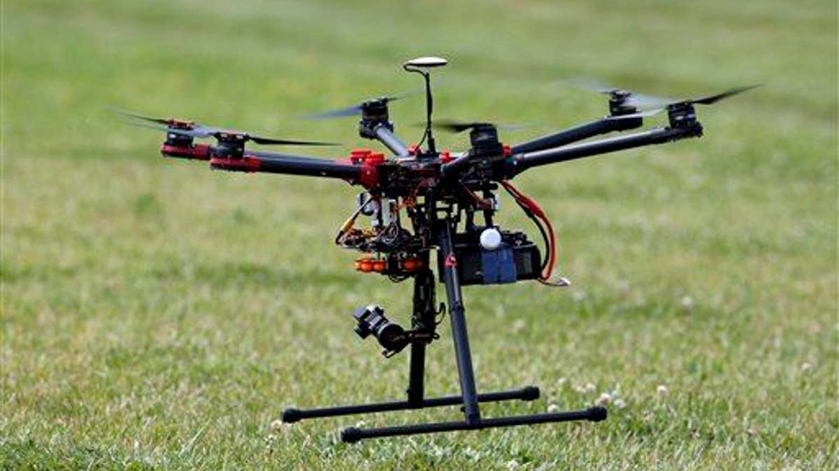 In this photo taken June 11, 2015, a hexacopter drone is flown during a demonstration in Cordova, Md.