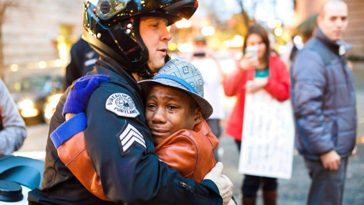 APTOPIX Ferguson Protest Embrace