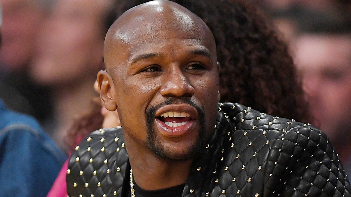 Boxer Floyd Mayweather Jr. watches during the second half of an NBA basketball game between the Los Angeles Lakers and the Los Angeles Clippers, Thursday, Oct. 19, 2017, in Los Angeles. The Clippers won 108-92. (AP Photo/Mark J. Terrill)