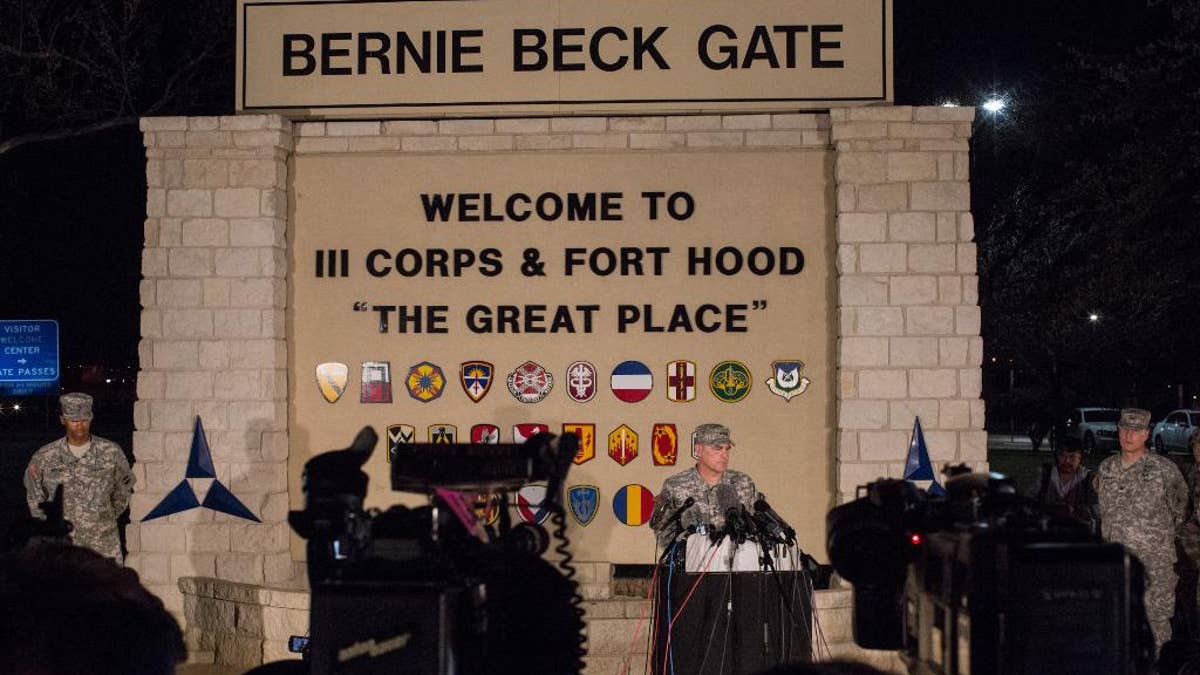 Lt. Gen. Mark Milley, commanding general of III Corps and Fort Hood, speaks with the press outside of an entrance to the Fort Hood military base following a shooting that occurred inside on April 2, 2014 in Fort Hood, TX. Four people died, including the gunman, and 16 were wounded in the attack. (AP Photo/ Tamir Kalifa)