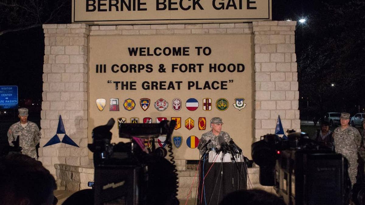 Lt. Gen. Mark Milley, commanding general of III Corps and Fort Hood, speaks with the press outside of an entrance to the Fort Hood military base following a shooting that occurred inside on April 2, 2014 in Fort Hood, TX. Four people died, including the gunman, and 16 were wounded in the attack. (AP Photo/ Tamir Kalifa)