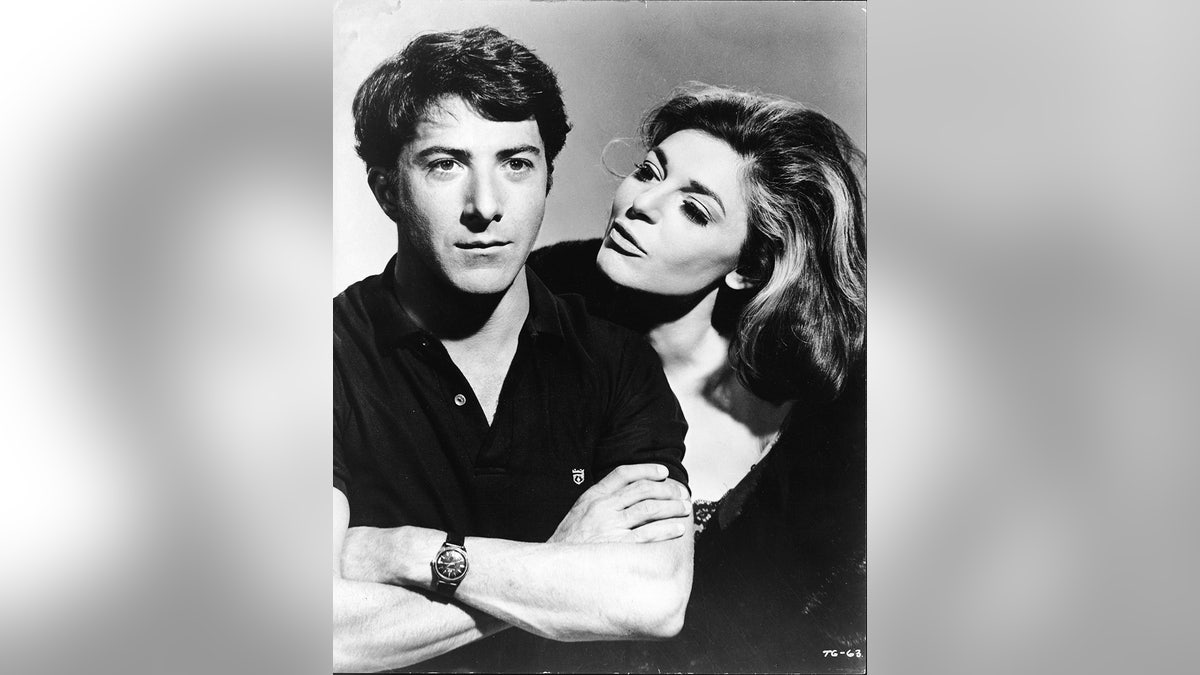 American actress Anne Bancroft (1931 - 2005), in character as the seductive older woman Mrs. Robinson, looks at American actor Dustin Hoffman, as Benjamin Braddock, in a publicity still from the film 'The Graduate' directed by Mike Nichols, California, 1967. (Photo by Embassy Pictures/MGM Studios/Courtesy of Getty Images)