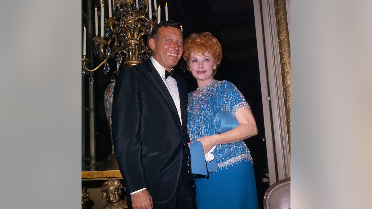 12/23/64-ORIGINAL CAPTION READS: Lucille Ball, actress comedian, with husband Gary Morton. Good closeup together.