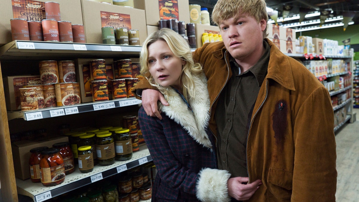In this image released by FX, Kirsten Dunst, left, and Jesse Plemons appear in a scene from 