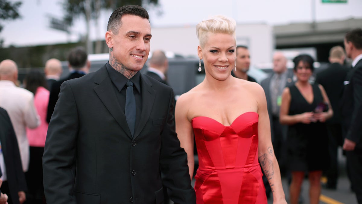 LOS ANGELES, CA - JANUARY 26:  Off-road truck racer Carey Hart and singer Pink attend the 56th GRAMMY Awards at Staples Center on January 26, 2014 in Los Angeles, California.  (Photo by Christopher Polk/Getty Images for NARAS)