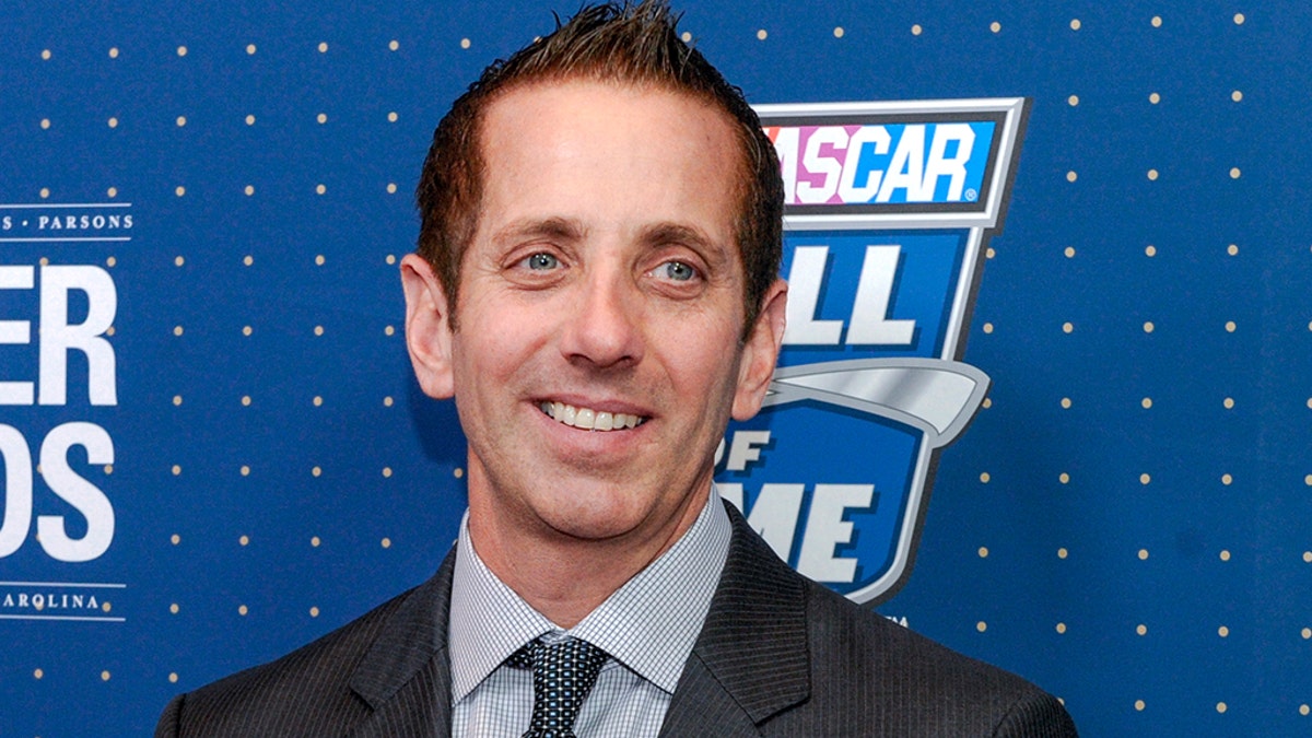 Greg Biffle poses for photographers on the red carpet before the NASCAR Hall of Fame Induction ceremony in Charlotte, N.C., Friday, Jan. 20, 2017