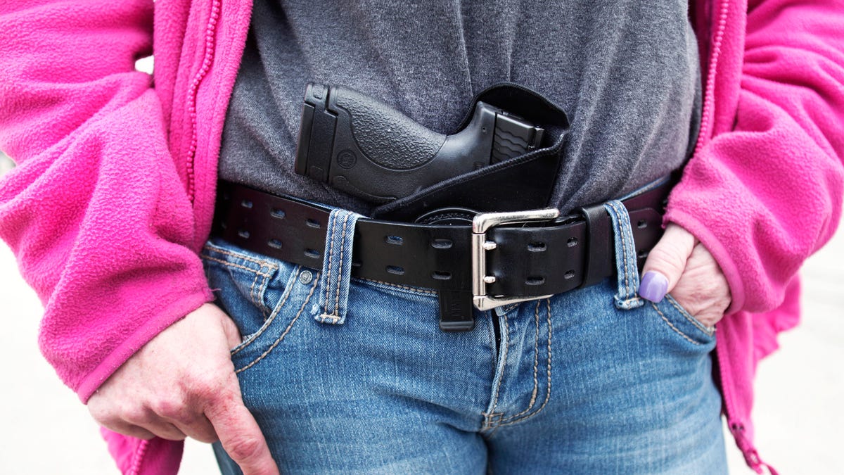 ROMULUS, MI - APRIL 27: Gloria Lincoln-Thompson of Garden City, Michigan carries her Smith & Wesson Shield 9mm pistol in her belt while participating in a rally and march supporting Michigan's Open Carry law April 27, 2014 in Romulus, Michigan. The march was held to attempt to demonstrate to the general public what the typical open carrier is like. (Photo by Bill Pugliano/Getty Images)