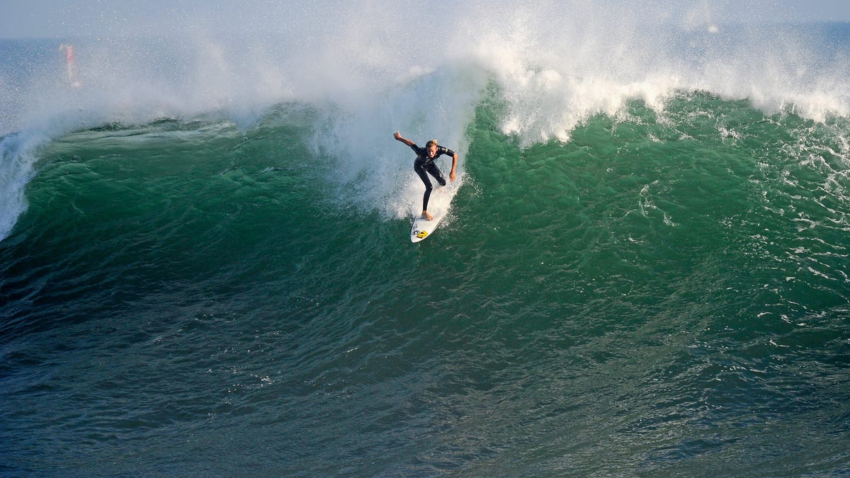 NEWPORT BEACH, CA - SEPTEMBER 01: A surfer rides a high wave at The Wedge on September 1, 2011 in Newport Beach, California. Waves measuring up to 20 feet pounded the beach. A winter storm off the coast of Australia and New Zealand brought unusually high surf to the Southern California beaches. (Photo by Kevork Djansezian/Getty Images)