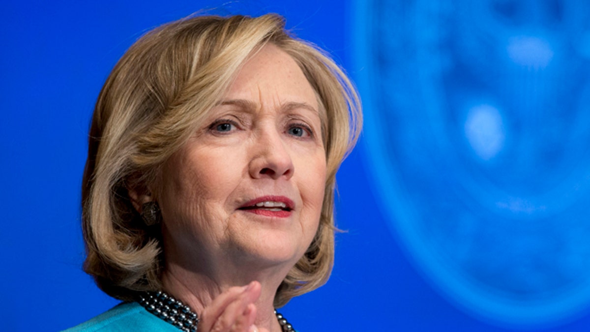 FILE - In this Dec. 3, 2014 file photo, former Secretary of State Hillary Rodham Clinton speaks at Georgetown University in Washington. The State Department is withholding documents covering Clinton's tenure as secretary of state ahead of her presumptive  presidential campaign. The Associated Press asked for files under the U.S.  Freedom of Information Act, including one request it made four years ago. (AP Photo/Carolyn Kaster, File)