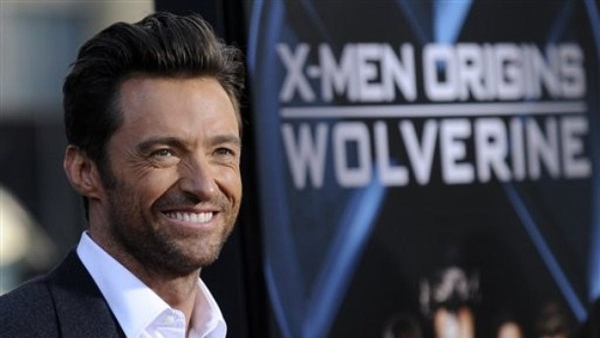 Hugh Jackman, left, star of "X-Men Origins: Wolverine," arrives at an industry screening of the film in Los Angeles, Tuesday, April 28, 2009. (AP Photo/Chris Pizzello)