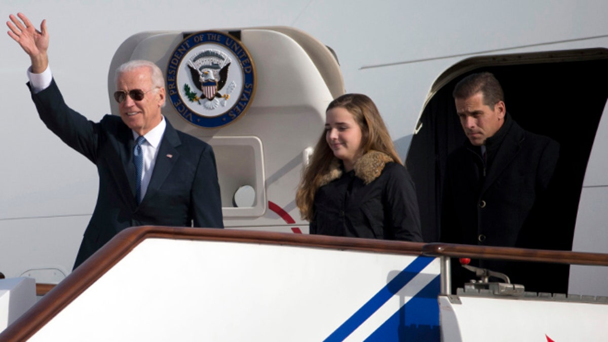 FILE: Dec. 4, 2013: from left, Vice President Joe Biden, granddaughter Finnegan Biden, son Hunter Biden, arriving in Beijing, China.