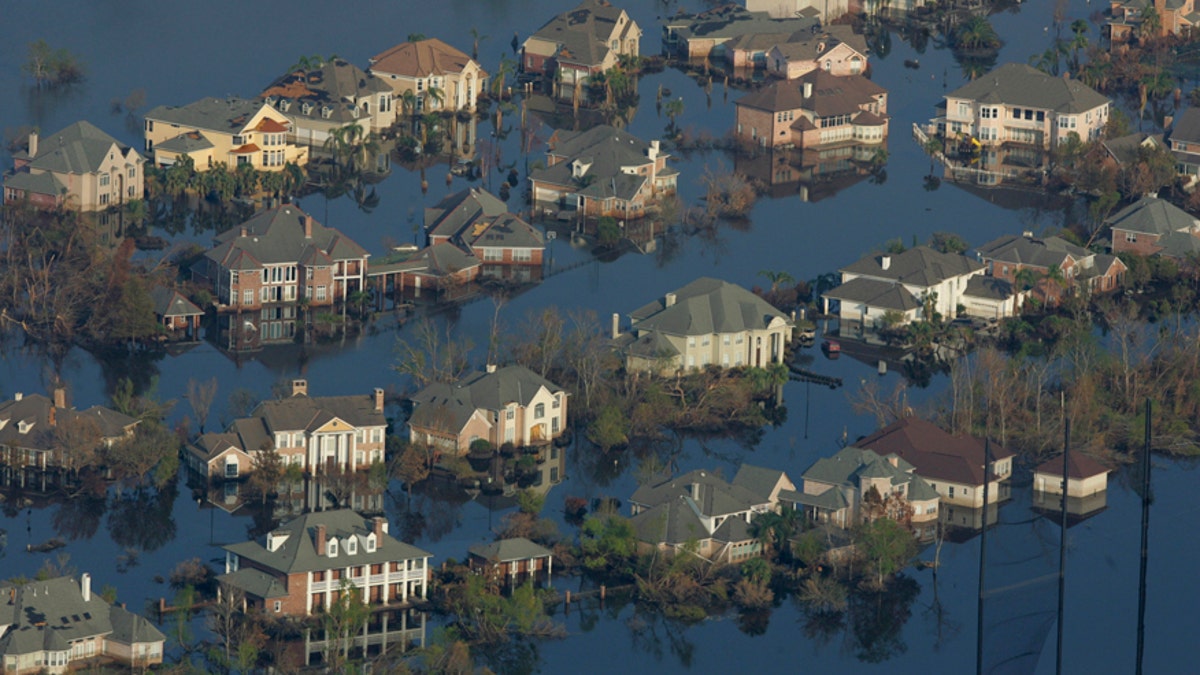 Neighborhoods are flooded with oil and water two weeks after Hurricane Katrina went though New Orleans, Sept. 12, 2005. 