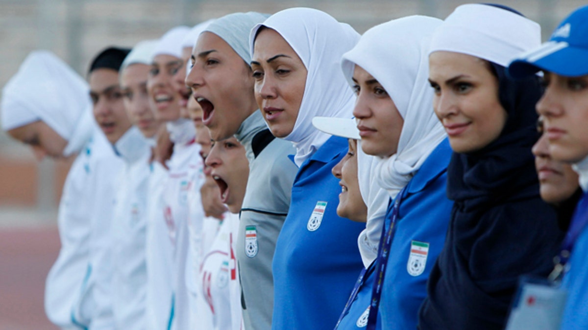 The Iranian women's national soccer team lines up before its qualifying match against Jordan for the 2012 London Olympic Games in Amman, June 3, 2011. The Iranian team was banned from the match on Friday in the second round of qualifiers in protest against guidelines on its headscarves.