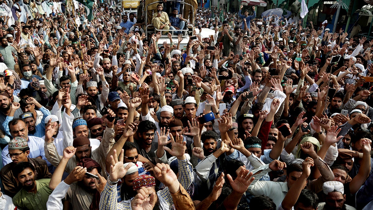 Supporters of Pakistani religious group shout slogans during a march towards Islamabad Wednesday, Aug. 29, 2018 in Lahore, Pakistan.