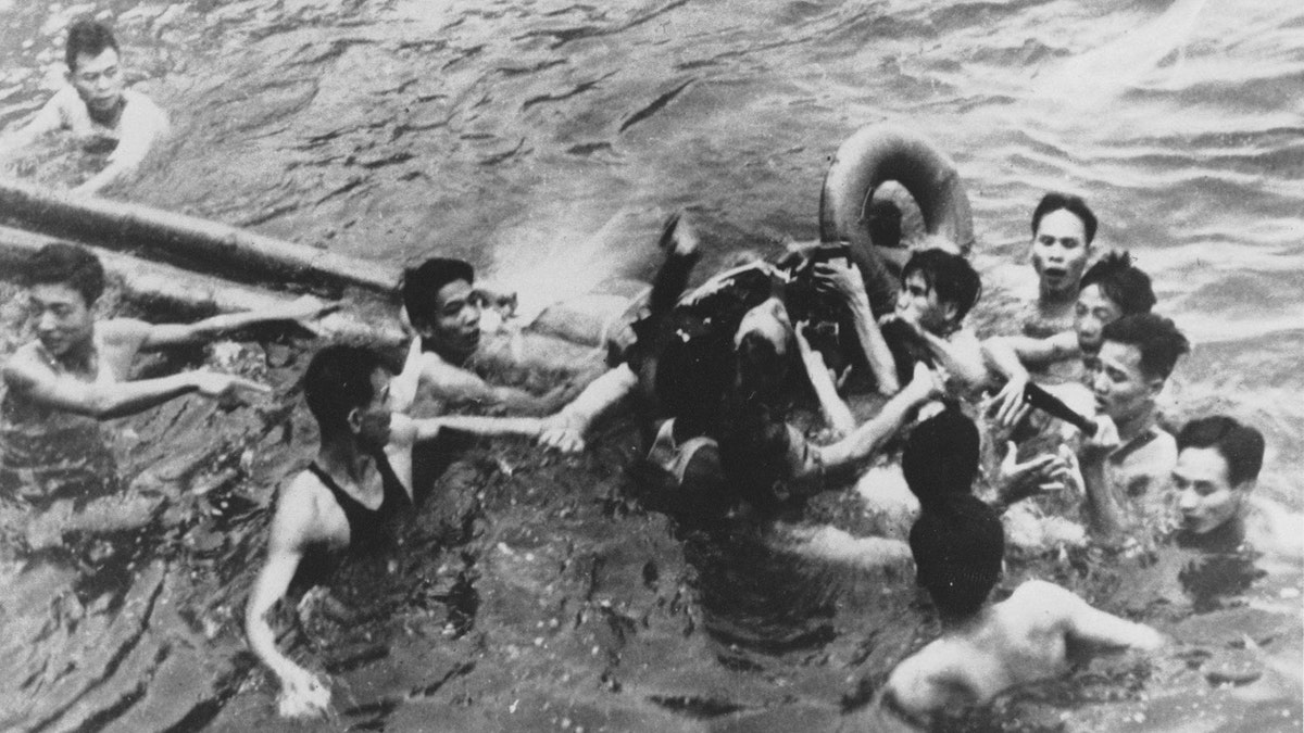 FILE PHOTO 26OCT67 - John McCain is pulled out of a Hanoi lake by a mix of North Vietnamese Army (NVA) and Vietnamese citizens in this October, 1967 file photo. McCain, currently a Republican presidential candidate, was shot down by a Surface-to-Air Missile (SAM) and had broken both arms and his right knee upon ejection, losing consciousness until he hit the water.
HB/ - RP2DRHYBNYAB