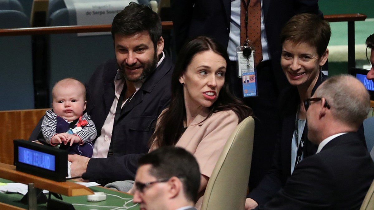 New Zealand Prime Minister Jacinda Ardern sits with her baby Neve before speaking at the Nelson Mandela Peace Summit during the 73rd United Nations General Assembly in New York, U.S., September 24, 2018. REUTERS/Carlo Allegri - RC1D451BD190