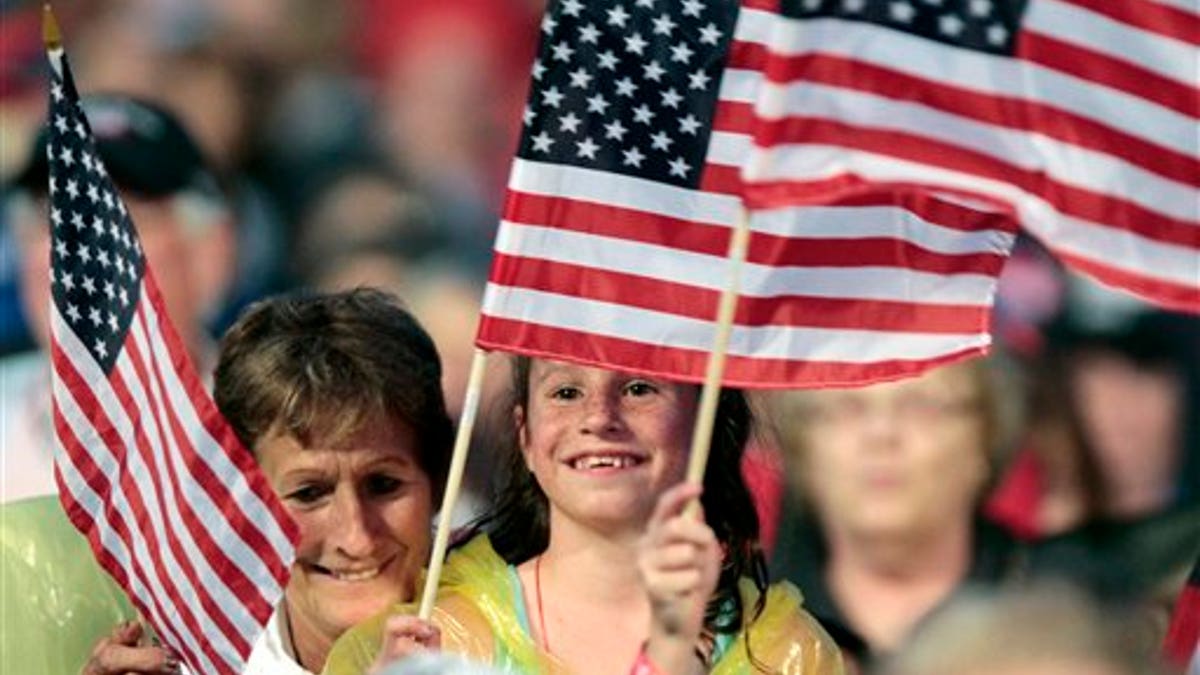 American kids wave flags for Independence Day