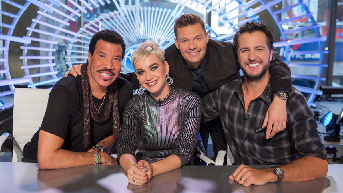 This image released by ABC shows, from left, Lionel Richie, Katy Perry, Ryan Seacrest and Luke Bryan in New York. Richie, Perry and Bryan are the judges on the next season of