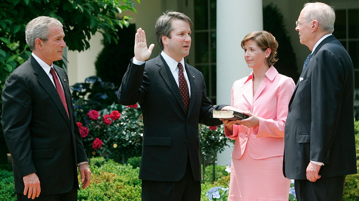 President Bush watches the swearing-in of Brett Kavanaugh as Judge for the US Court of Appeals. June 1 2006 AP