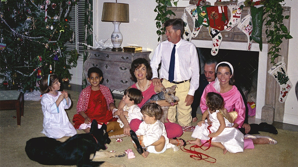 ST-C72-3-62 25 December 1962 President John F. Kennedy celebrates Christmas with family and friends at the residence of Captain Michael Paul in Palm Beach, Florida. (L-R): Caroline Kennedy; unidentified child; First Lady Jacqueline Kennedy holding her nephew Anthony Radziwill; John F. Kennedy, Jr.; President Kennedy; Prince Stanislaw Radziwill of Poland; Princess Lee Radziwill (Mrs. Kennedyâs sister) holding her daughter Anna Christina Radziwill. Also included are two of the Kennedy familyâs dogs, Clipper and Charlie. Please credit âCecil Stoughton. White House Photographs. John F. Kennedy Presidential Library and Museum, Bostonâ