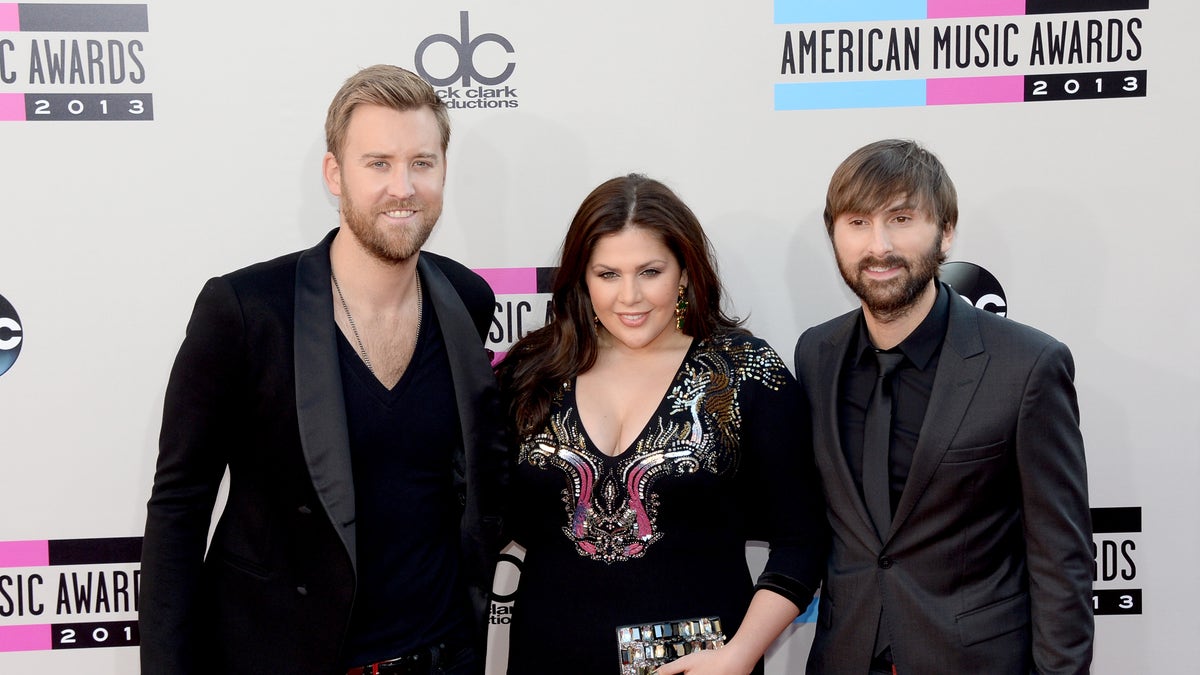 LOS ANGELES, CA - NOVEMBER 24:  (L to R) Charles Kelly, Hillary Scott and Dave Haywood of Lady Antebellum attends the 2013 American Music Awards at Nokia Theatre L.A. Live on November 24, 2013 in Los Angeles, California.  (Photo by Jason Kempin/Getty Images)