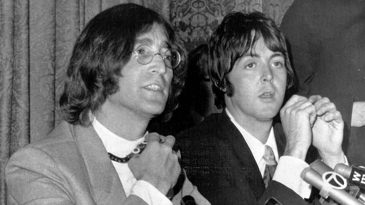 Members of the British pop group The Beatles, John Lennon, left,and Paul McCartney, announce that Beatles Ltd., is being reorganized for bigger things as Apple Corps Ltd., in New York, NY, May 15, 1968. The new company, owned equally by all four Beatles, will make films, produce records and own clothing stores in London. (AP Photo)