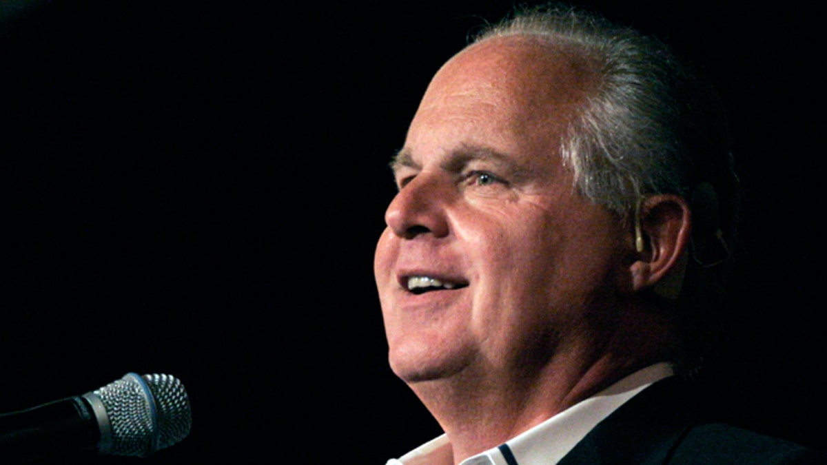 Radio talk show host and conservative commentator Rush Limbaugh speaks in Novi, Michigan. (Photo by Bill Pugliano/Getty Images)