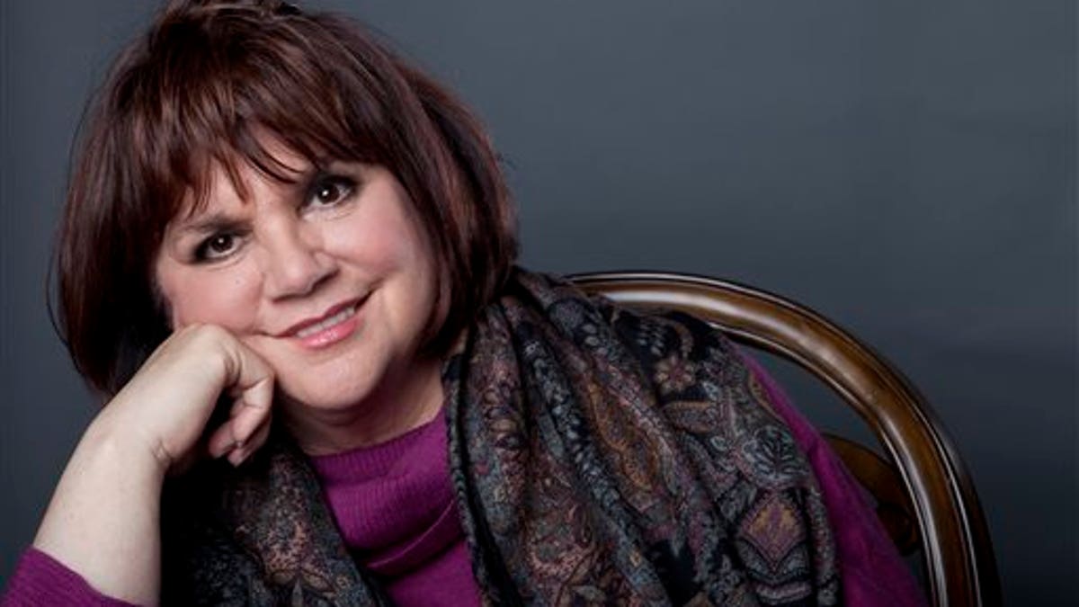 FILE - In this Sept. 17, 2013 file photo, American musician Linda Ronstadt poses in New York to promote the release of her memoir 