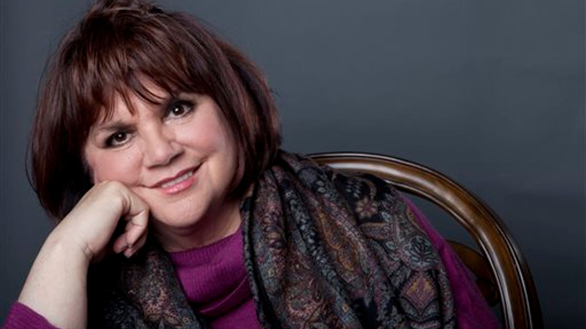 FILE - In this Sept. 17, 2013 file photo, American musician Linda Ronstadt poses in New York to promote the release of her memoir 