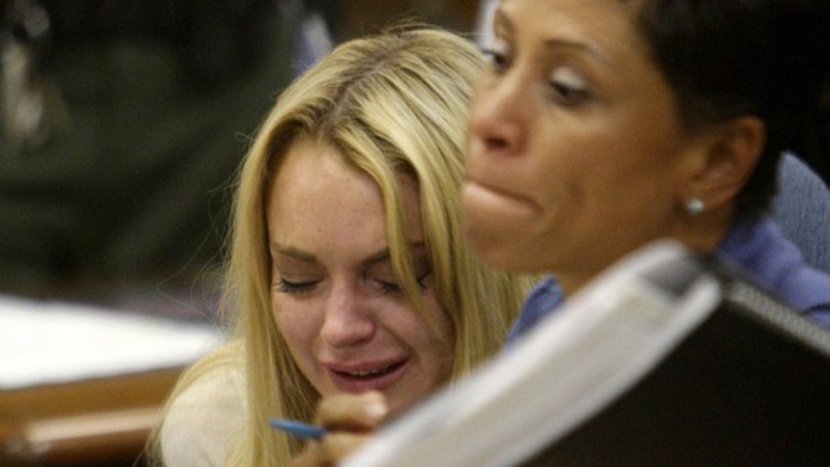 July 6: Lindsay Lohan cries in a Beverly Hills Court House after being sentenced to 90 days in jail.