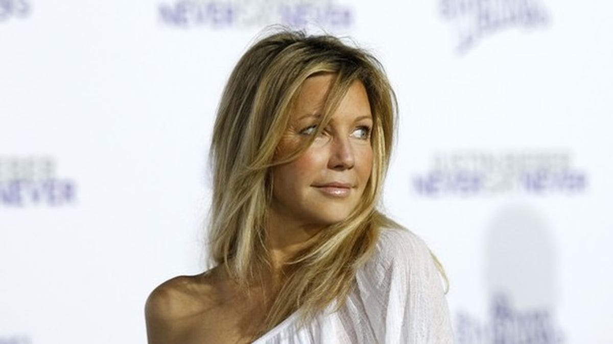 Actress Heather Locklear poses at the premiere of the documentary 