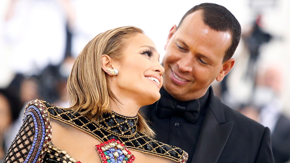 Singer Jennifer Lopez and baseball personality Alex Rodriguez arrive at the Metropolitan Museum of Art Costume Institute Gala (Met Gala) to celebrate the opening of Ã¬Heavenly Bodies: Fashion and the Catholic ImaginationÃ® in the Manhattan borough of New York, U.S., May 7, 2018. REUTERS/Eduardo Munoz - HP1EE58039ZDP